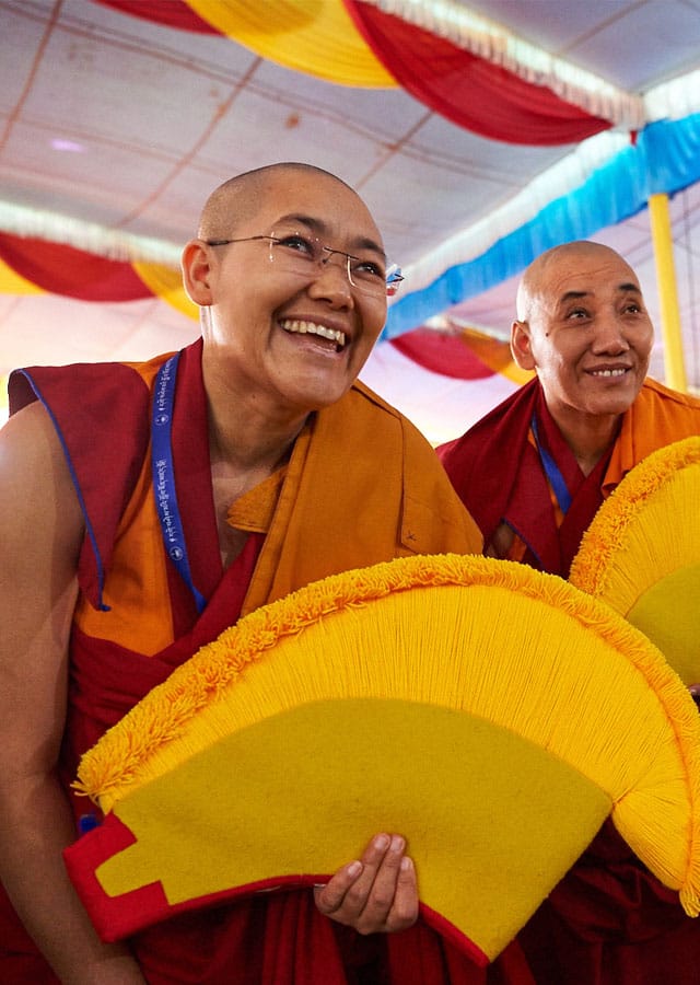 A handful of the twenty nuns smile while waiting to be awarded their geshema degrees. Photo by Olivier Adam.