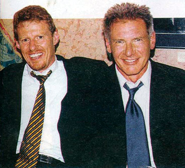 Scott Neeson, seen here with Harrison Ford, started out as a projectionist at a drive-in and worked his way up to president of Twentieth Century Fox International.