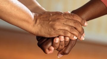 Clasped hands.