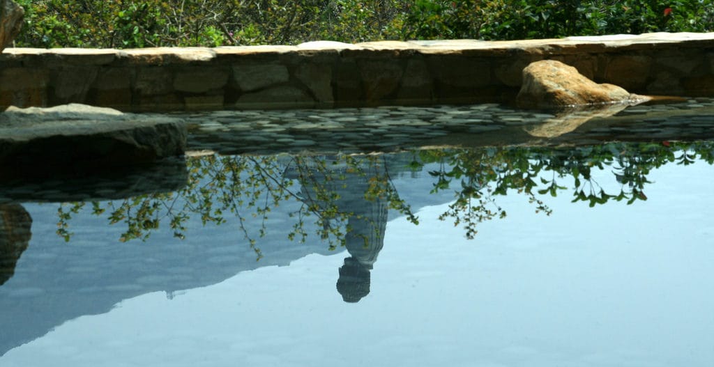 Reflection of a person in a lake.