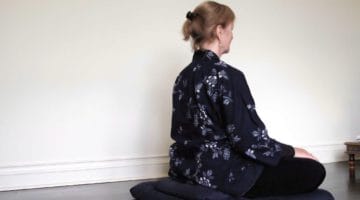 Person meditating.