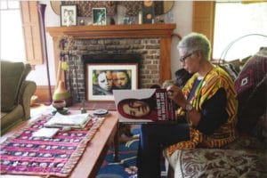 Walker reading If You Know Me You Would Care , a collections of stories and photos of women who have survived war, violence and poverty. Walker, who was very moved by this book, refers to herself as a "womanist", a feminist of color. 