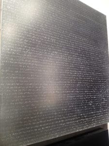 Ando's new work Shako, an aluminum panel inscribed by hang with the Nichiren prayer Na mu myo ho ren ge kyo, ("I take refuge in the wonderful law of the Lotus Sutra.")
