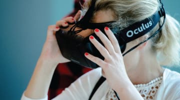 A woman wears Oculus Rift.