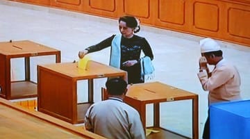 Aung San Suu Kyi casts her ballot in Tuesday's election.