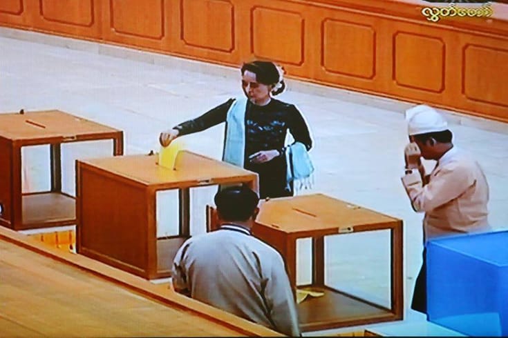 Aung San Suu Kyi casts her ballot in Tuesday's election.