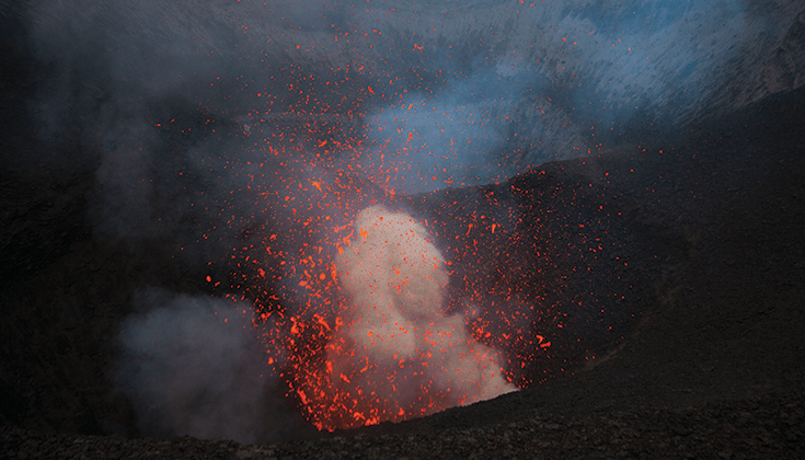 Photo of a volcano erupting.