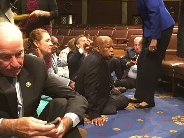 Rep. John Lewis sitting on the house floor.
