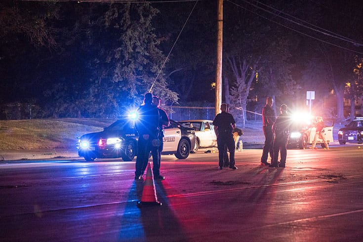 Police officers stand near the car that Philando Castile was sitting in when he was shot and killed by a police officer in St. Paul, Minnesota, on July 6.