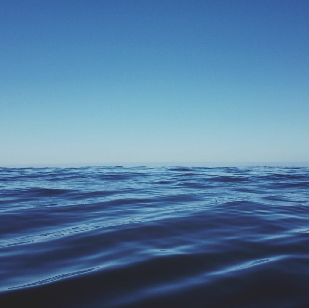 Ocean with a blue sky above.