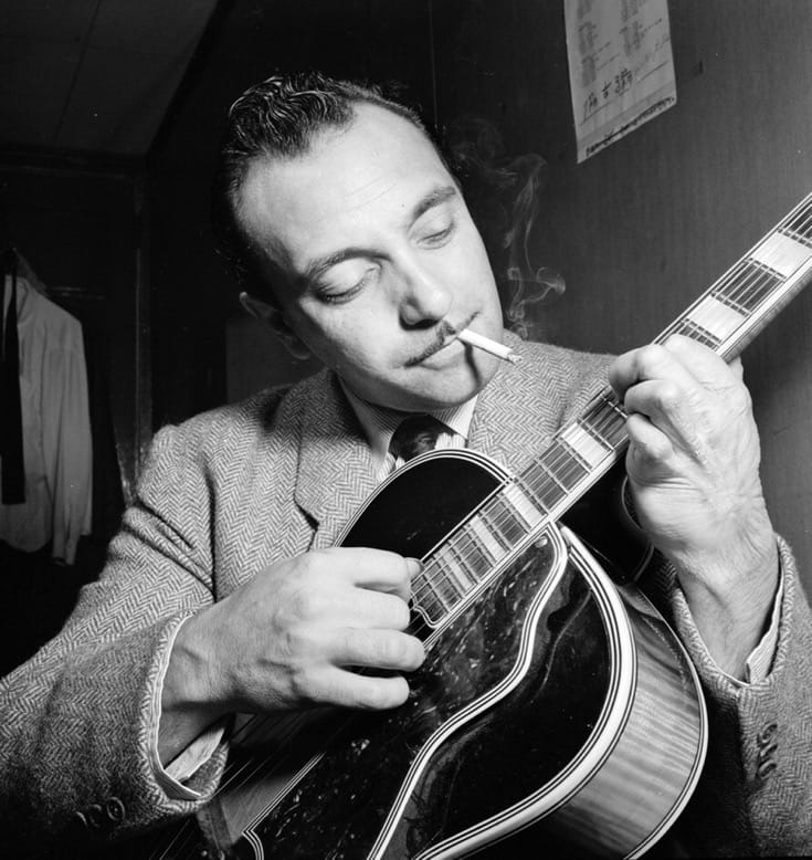 Django Reinhardt playing the guitar.