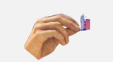 Hand holding a man standing at a lectern.