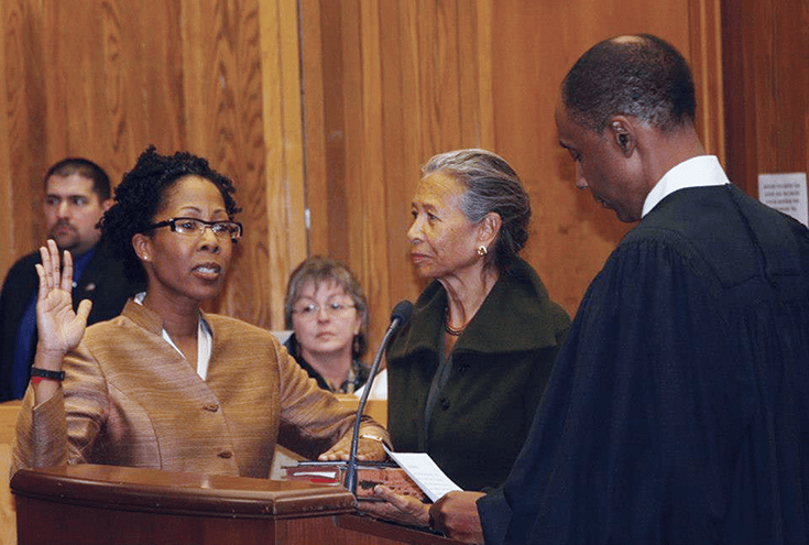Gretchen Rohr, in a 2013 ceremony, is installed as a magistrate judge in the D.C. Superior Court by Superior Court Chief Judge Lee F. Satterfield. To her left is her Buddhist teacher, Gina Sharpe, founder of New York Insight.