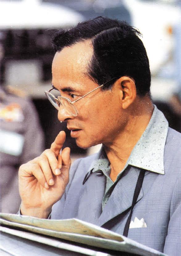 This famous photo of King Bhumibol is a favorite of the Thai people, who see it as emblematic of all the work he did on their behalf.