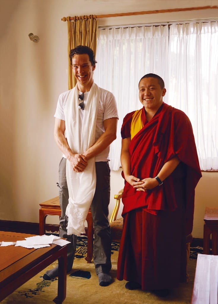 Benedict Cumberbatch smiling, standing with Dilgo Khyentse Yangsi Rinpoche.