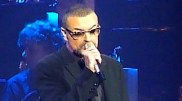 George Michael sings on his "Symphonica" tour, 2011. (Photo by Frantogian, Creative Commons.)