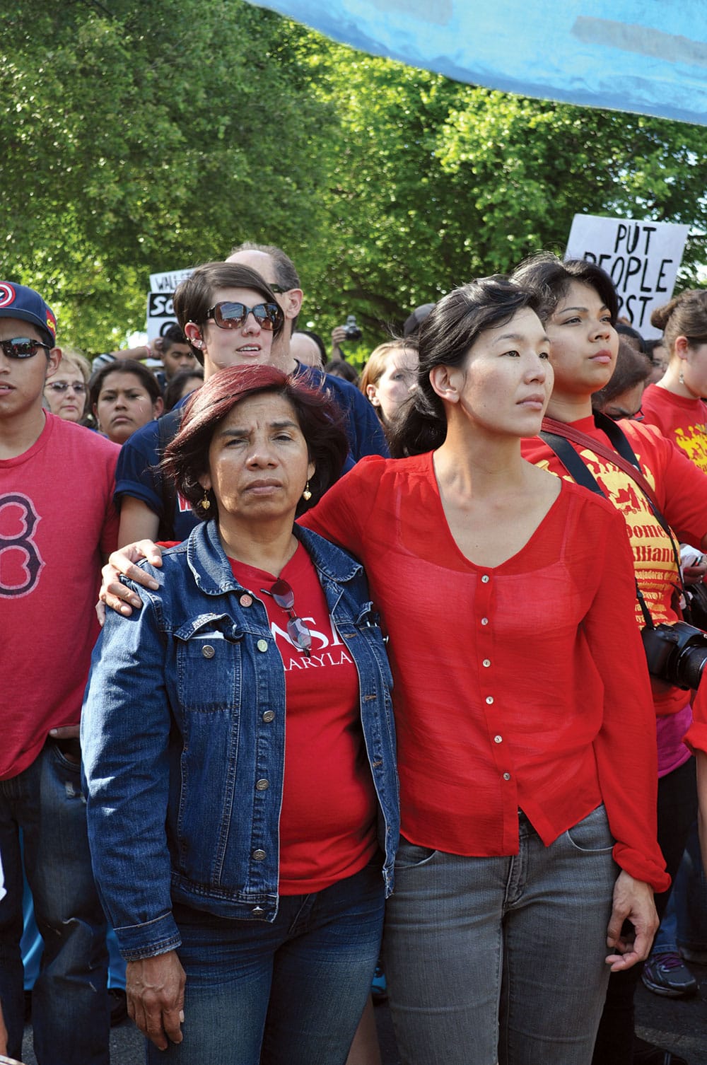 Ai-jen Poo (right) marching with the National Domestic Workers Alliance in Washington. She fights for living wages, benefits, and legal protections for caregivers and other domestic workers. Photo by Bekah Mandell.
