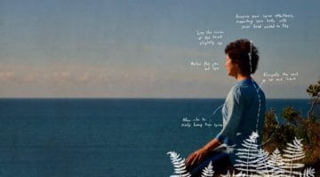 A meditator sitting in nature, overlooking the water.