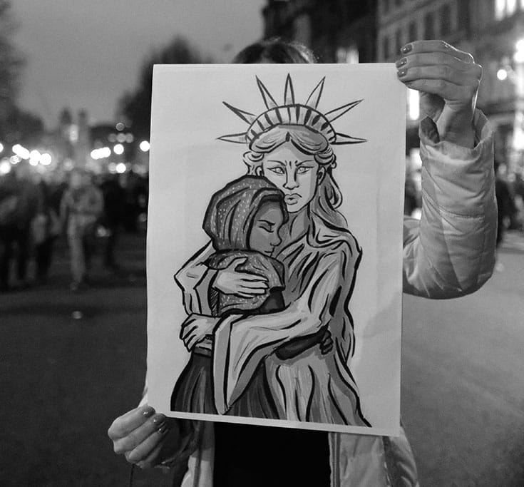 Demonstrator with a message at a rally in London. Photo by Alisdare Hickson.