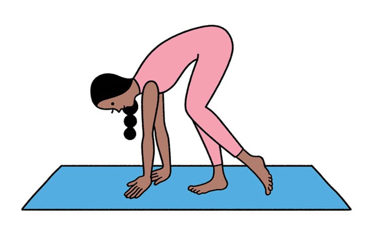 Woman forward bending on yoga mat