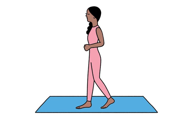 Woman standing on yoga mat