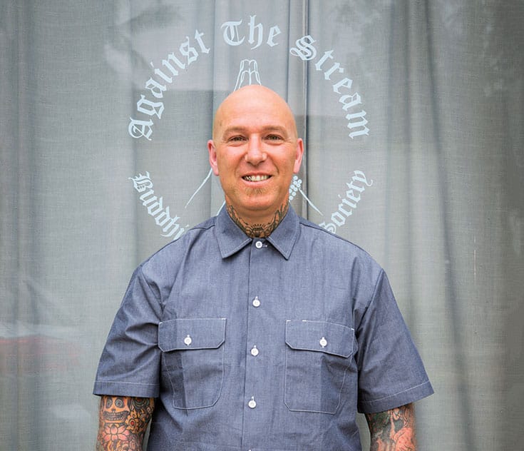 Noah Levine in front of Against the Stream Buddhist meditation society. Photo by Sarit Z. Rogers.
