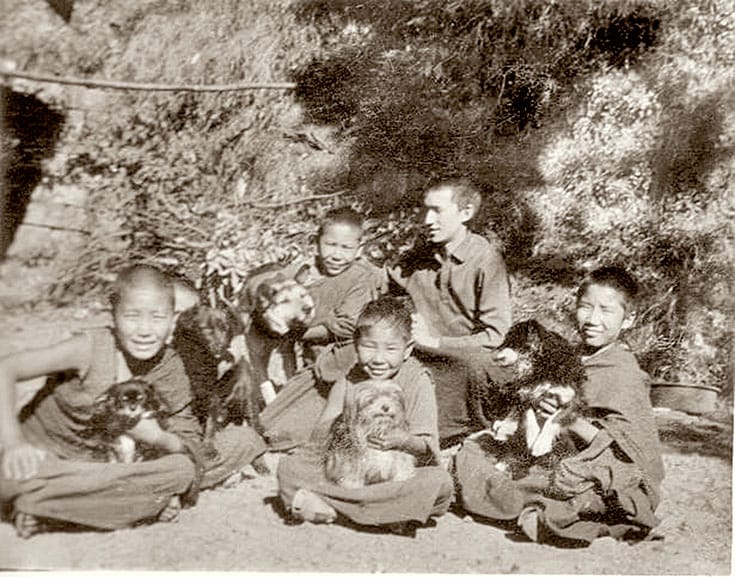 At age 11, Thupten Jinpa (far right, with his dog, Dorje) entered Dzongkar Choede monastery in southern India, where he was frustrated by the emphasis on rote learning.