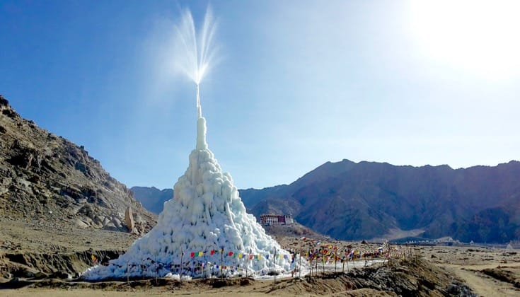 Ice Stupa spraying water into the sky.