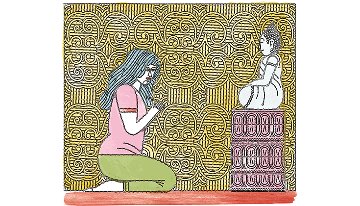 A Buddhist praying before a statue of a bodhisattva.