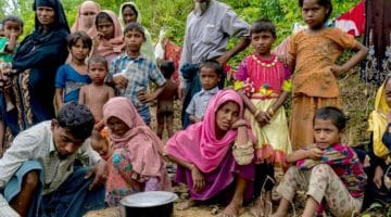 Rohingya family on the side of the road.