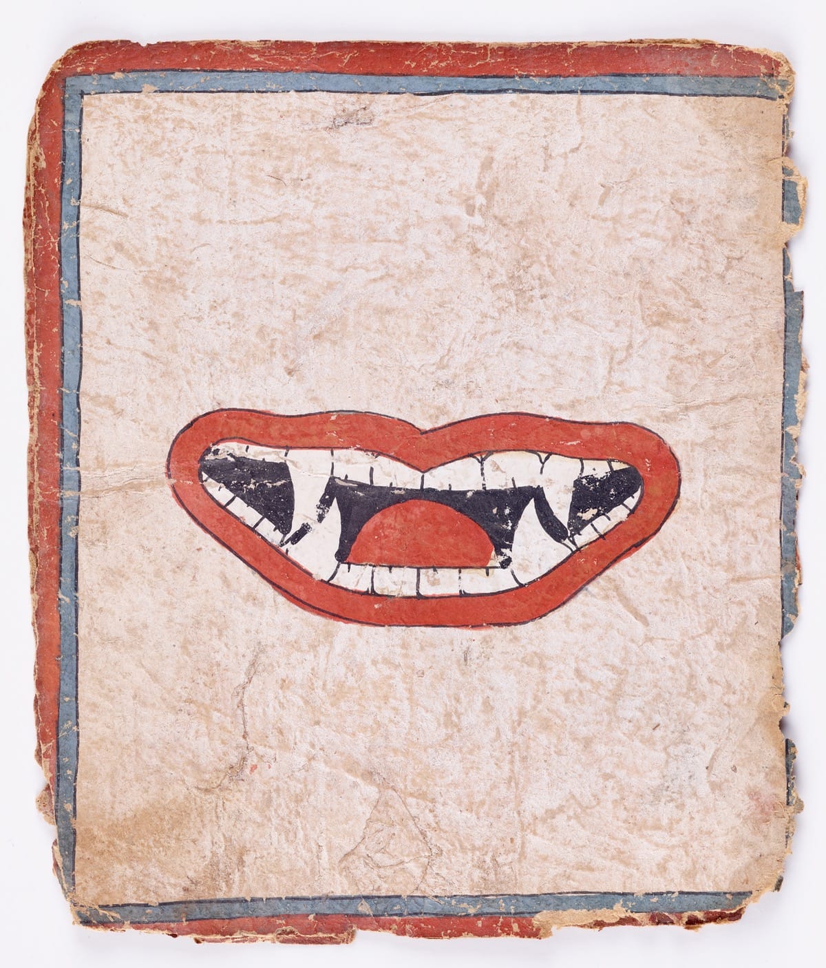 Image of fanged mouth on paper.