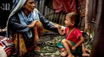 A woman and child in a refugee camp.