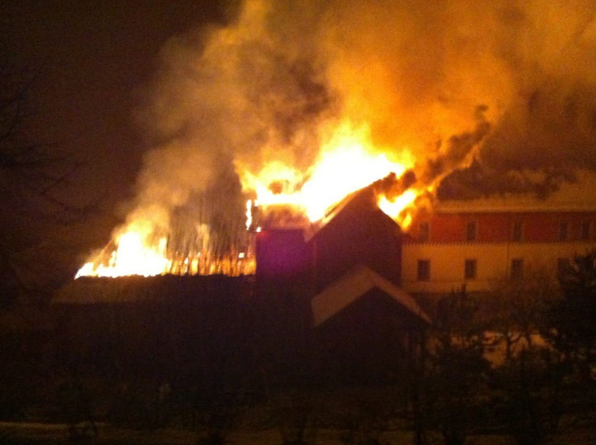 Building on fire in the night at Shangpa Karmaling.