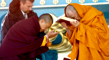 Sakyong Mipham presenting an award to the Dalai Lama