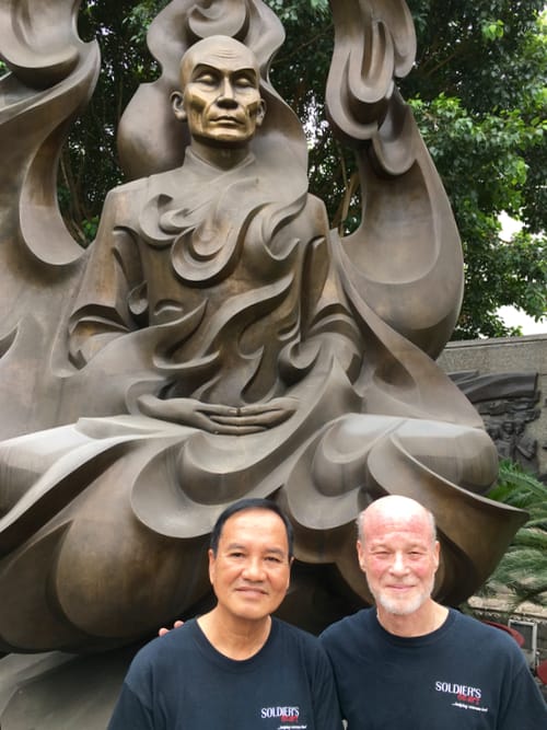 The author with his guide in front of a memorial to Thich Quang Duc.