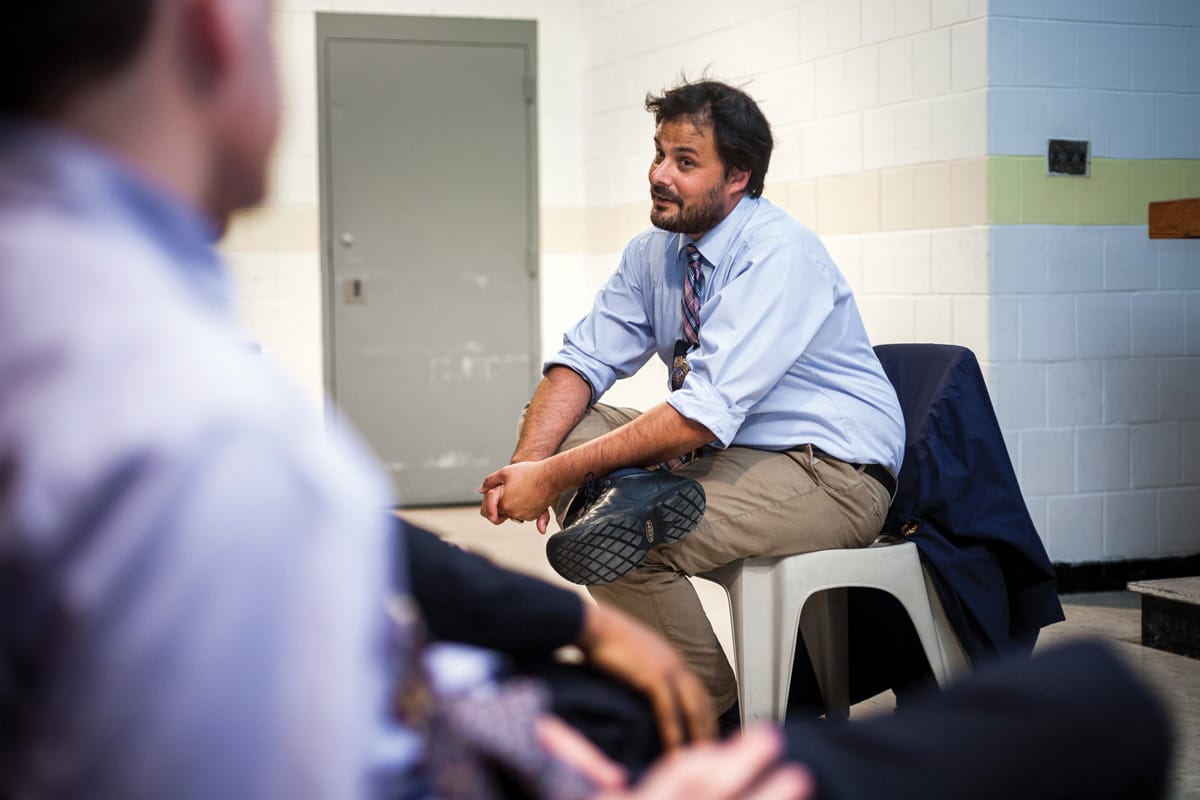 Justin von Bujdoss sitting and talking in Rikers Island