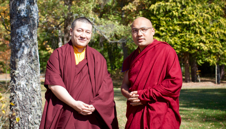 The two Karmapas standing next to each other.