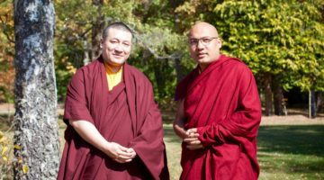 The two Karmapas standing next to each other.