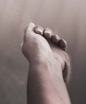 Hand scattering sand