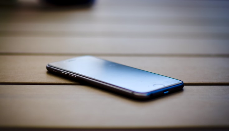 iPhone sitting on a table.