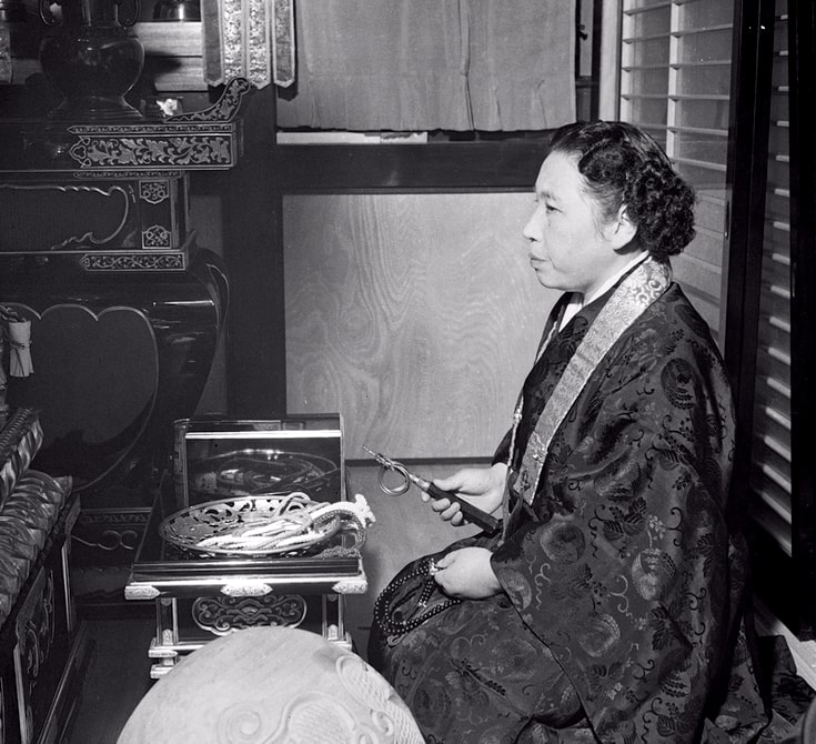 Tomoji Ito sitting.