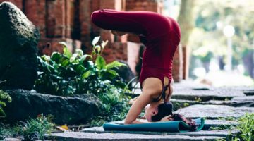 Yoga practitioner in upside down meditation posture.