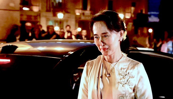 Aung San Suu Kyi getting out of a car.