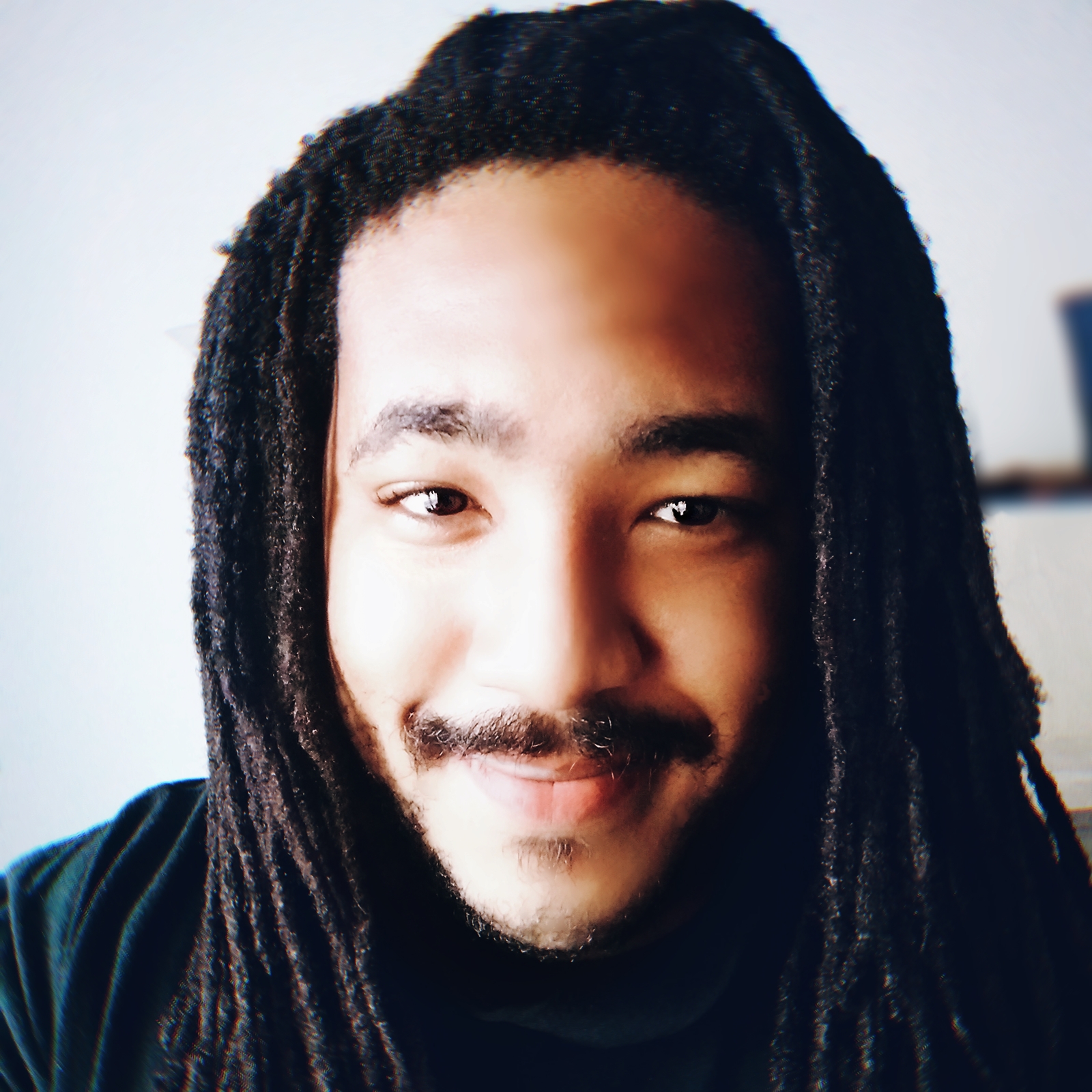 A portrait of a man smiling.