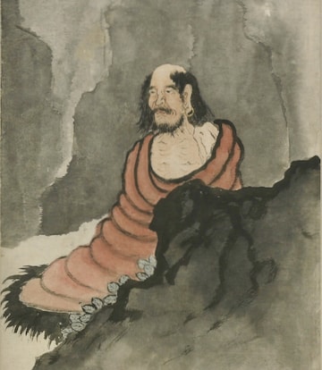 Bodhidharma meditating in a cave.