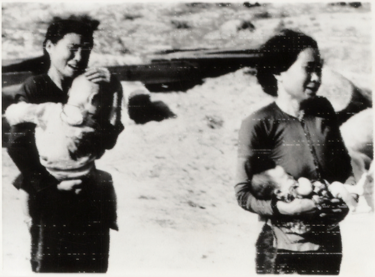 Vietnamese mothers crying while holding babies
