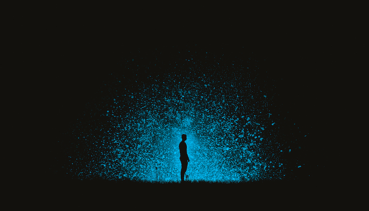 Person standing in blast of light