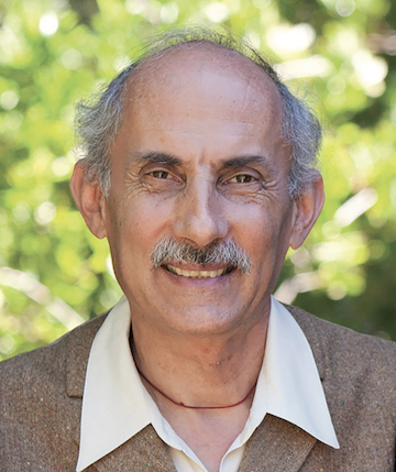 A photo of Jack Kornfield. He is balding with a moustache, and wearing a brown blazer and white collared shirt.