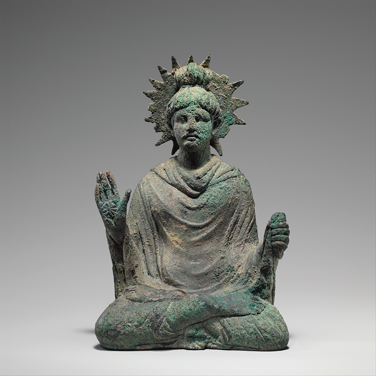 A statue of a person meditating.