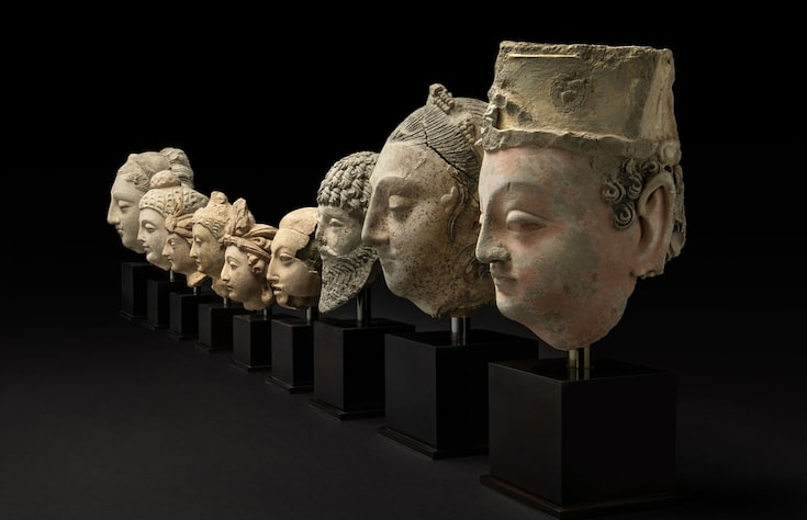 Row of heads from Buddhist sculptures